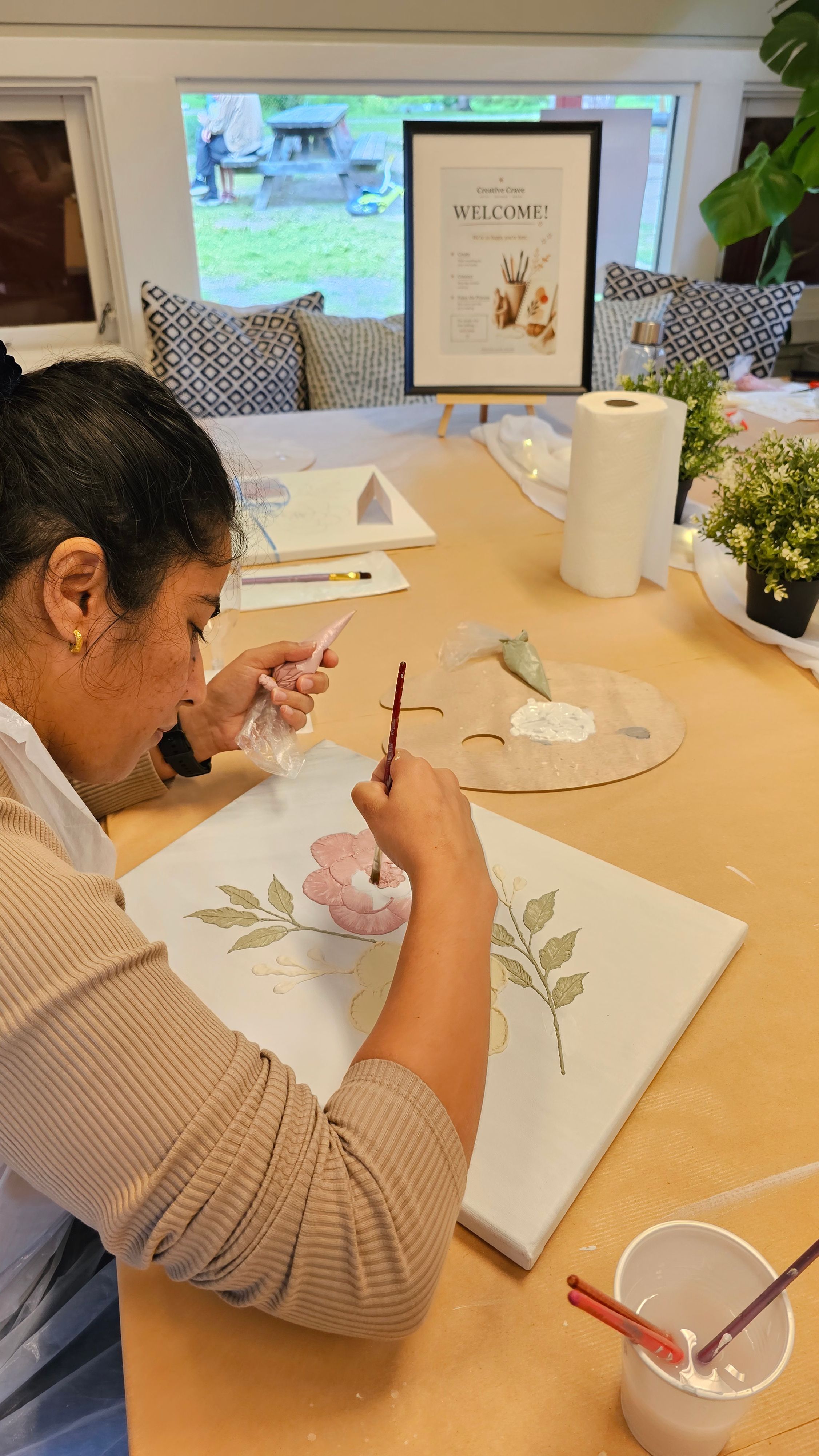 Workshop participant creating textured artwork